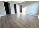 Spacious bedroom featuring new wood flooring, neutral paint and bright natural light at 534 Central Ave, Frostproof, FL 33843