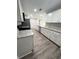 Spacious kitchen featuring granite countertops, stainless steel appliances, and ample cabinet space at 534 Central Ave, Frostproof, FL 33843