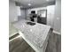 Modern kitchen with granite countertops, stainless steel appliances, and white cabinets at 534 Central Ave, Frostproof, FL 33843