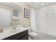 The bathroom features a shower/tub combo and a mirror over the vanity sink at 5353 Oakbourne Ave, Davenport, FL 33837