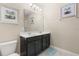 Bathroom with double sink vanity and decoratively framed mirrors providing an elegant, upscale feel at 5353 Oakbourne Ave, Davenport, FL 33837