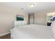 Inviting bedroom with a bright dresser, providing ample storage and surface space at 5353 Oakbourne Ave, Davenport, FL 33837
