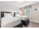 This bedroom features 2 twin beds and a well-lit window at 5353 Oakbourne Ave, Davenport, FL 33837