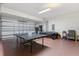 Spacious garage with a ping pong table, billiards table, and abundant extra storage space at 5353 Oakbourne Ave, Davenport, FL 33837