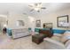 Inviting living room is furnished with comfortable seating, tile floors, and a flatscreen TV for relaxation at 5353 Oakbourne Ave, Davenport, FL 33837
