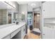 Contemporary bathroom featuring an updated vanity, natural light, and a walk-in shower providing style and function at 5370 Whispering Pine Cir, St Cloud, FL 34771