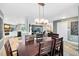 Open-concept dining area seamlessly connects to the kitchen and living room for easy entertaining at 5370 Whispering Pine Cir, St Cloud, FL 34771