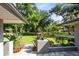 Well-manicured front yard with lush landscaping and a charming pathway leading to the inviting home at 5370 Whispering Pine Cir, St Cloud, FL 34771