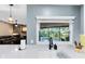 The kitchen sink features a modern faucet with a view of the outdoors and the backyard pool at 5370 Whispering Pine Cir, St Cloud, FL 34771