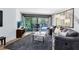 Comfortable living room with sliding glass doors that offer an expansive view of the lanai and pool at 5370 Whispering Pine Cir, St Cloud, FL 34771