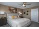 Serene bedroom with soft lighting, a king-size bed, and neutral decor creating a peaceful retreat at 7546 Headwaters Ct, Groveland, FL 34736