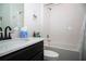 Bathroom featuring a tub and shower combination, vanity with white countertop, and a black faucet at 818 Kapi Dr, Groveland, FL 34736