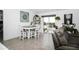 Cozy dining area adjacent to a sliding glass door and living room, with a table and chairs at 818 Kapi Dr, Groveland, FL 34736