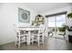 Bright dining area with a sliding glass door to a private balcony, perfect for relaxing at 818 Kapi Dr, Groveland, FL 34736