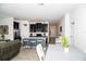 Contemporary kitchen island with bar seating, and an adjacent dining area with lots of natural light at 818 Kapi Dr, Groveland, FL 34736
