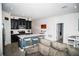 Well-equipped kitchen featuring an island with bar seating, stainless steel appliances, and dark cabinetry at 818 Kapi Dr, Groveland, FL 34736