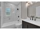 Modern bathroom with marble tile, updated fixtures, and a sleek vanity at 900 Citrus St, Orlando, FL 32805