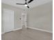 Spacious bedroom with hardwood flooring, closet, and ceiling fan at 900 Citrus St, Orlando, FL 32805