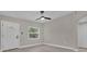 Bright bedroom featuring a large window, door and spacious closet at 900 Citrus St, Orlando, FL 32805