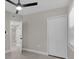 Open bedroom showcasing a ceiling fan and access to a closet and the hallway at 900 Citrus St, Orlando, FL 32805