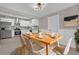 Dining area with a modern table setting, with kitchen in the background at 900 Citrus St, Orlando, FL 32805