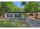 Charming single-story home featuring a bright green front door and a covered carport at 900 Citrus St, Orlando, FL 32805
