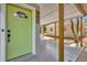 View of the house number, light green front door and covered parking area at 900 Citrus St, Orlando, FL 32805
