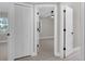 Bright hallway featuring white doors, trim and flooring at 900 Citrus St, Orlando, FL 32805