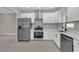 Well-equipped kitchen with stainless steel appliances and modern finishes at 900 Citrus St, Orlando, FL 32805
