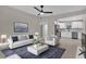 Open-concept living room flows into modern kitchen with stainless steel appliances at 900 Citrus St, Orlando, FL 32805