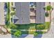 Beautiful aerial view of townhomes with manicured lawns, a brick patio, and private entrances at 9189 Camden Gardens St, Orlando, FL 32827