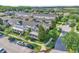 Aerial view of townhomes showing surrounding trees and neighborhood streets at 9189 Camden Gardens St, Orlando, FL 32827
