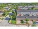 Overhead view of the townhome and surrounding area with lush green landscape at 9189 Camden Gardens St, Orlando, FL 32827