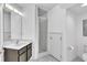 Bathroom features a shower with glass door, a vanity, and neutral wall color at 9189 Camden Gardens St, Orlando, FL 32827
