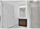Bathroom features a shower with glass door, vanity, and neutral wall color at 9189 Camden Gardens St, Orlando, FL 32827