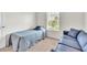Cozy bedroom showcases a twin bed and sofa, offering a comfortable and inviting space at 9189 Camden Gardens St, Orlando, FL 32827