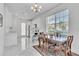 Dining area featuring an ornate table and chairs next to the bright and airy kitchen at 9189 Camden Gardens St, Orlando, FL 32827