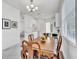 Bright dining area features a chandelier and adjacent kitchen space at 9189 Camden Gardens St, Orlando, FL 32827