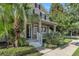 Inviting home exterior showcasing a well-manicured lawn and tropical foliage at 9189 Camden Gardens St, Orlando, FL 32827