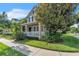 Beautiful home exterior with a manicured lawn, mature trees, and a welcoming front porch at 9189 Camden Gardens St, Orlando, FL 32827