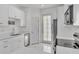 Bright kitchen with all-white cabinets, stainless steel appliances, and door to the outside at 9189 Camden Gardens St, Orlando, FL 32827