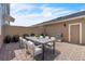 Private brick-paved courtyard features a modern outdoor dining set and stainless steel grill at 9189 Camden Gardens St, Orlando, FL 32827