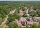 Aerial view shows a neighborhood with mature trees at 103 Red Cedar Dr, Longwood, FL 32779