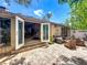 Inviting backyard patio featuring outdoor furniture and access through french doors at 103 Red Cedar Dr, Longwood, FL 32779