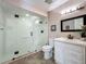 Bright bathroom features an updated glass shower with white tiles and a vanity with modern fixtures at 103 Red Cedar Dr, Longwood, FL 32779