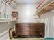 Organized walk-in closet featuring a dresser, shelves, and hanging storage at 103 Red Cedar Dr, Longwood, FL 32779