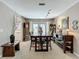 Comfortable dining room with backyard access, neutral walls, and wooden furniture at 103 Red Cedar Dr, Longwood, FL 32779