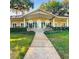 Home exterior featuring walkway and lawn at 103 Red Cedar Dr, Longwood, FL 32779