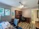 Bright home office with hardwood floors, built-in shelving, and a computer desk at 103 Red Cedar Dr, Longwood, FL 32779