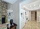 Bright kitchen area showcases the flooring, view to the stone facade wall and the adjoining dining area at 103 Red Cedar Dr, Longwood, FL 32779